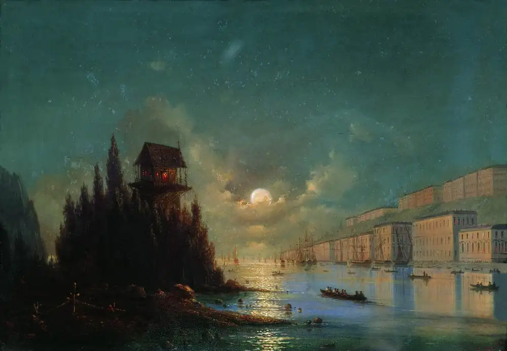 View of seaside town in the evening with a lighthouse